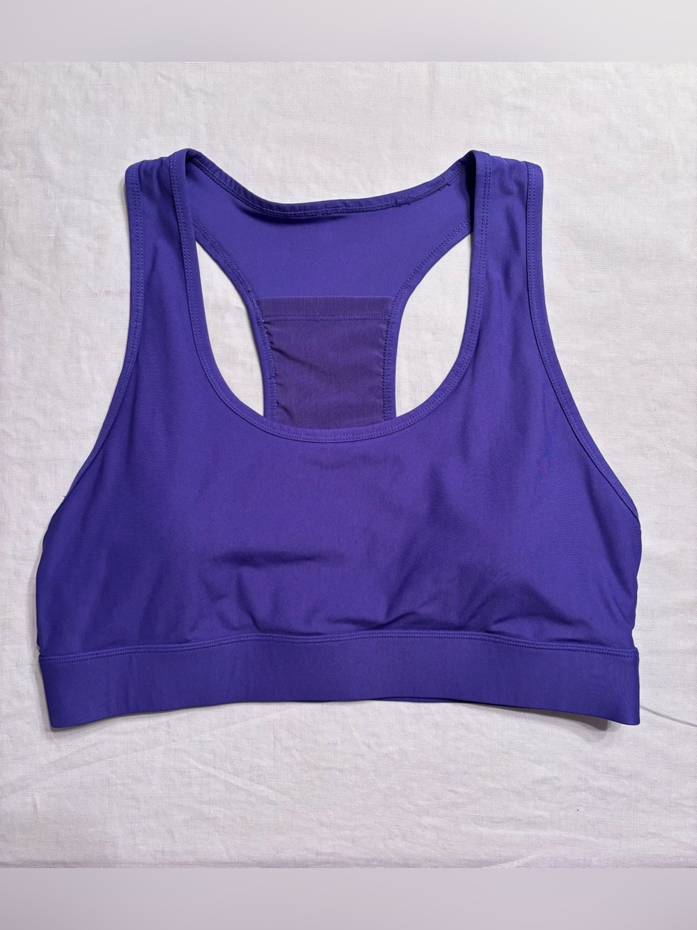 Fabletics On-The-Go Medium Impact Sports Bra in Indigo